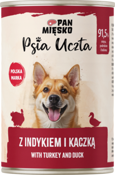 Puszka Pan Mięsko Psia Uczta Z indykiem i kaczką, biało-czerwona, z radosnym psem i 91,5% składników zwierzęcych.