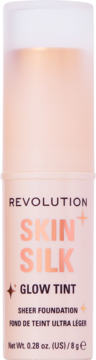 REVOLUTION SKIN+SILK GLOW TINT, podkład w jasnej brzoskwiniowej butelce z złotymi i czarnymi napisami, przód.