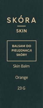 Ciemnozielona etykieta Skóra Skin Orange 23G, balsam do pielęgnacji skóry, z beżowym tekstem i ramką.