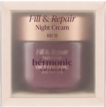 Bogaty krem na noc Fill & Repair hérmonic w purpurowym słoiczku z różowozłotą nakrętką, w pudełku z oknem.