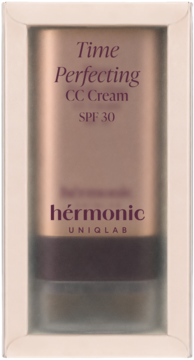 Hermonic Time Perfecting CC Cream SPF 30 w brązowo-złotej tubce z metalicznym połyskiem, w beżowym opakowaniu z okienkiem.