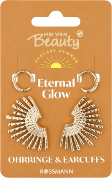 Złoty zestaw: kolczyki wachlarze i nausznice kółka z teksturą, na brązowym opakowaniu Eternal Glow Rossmann.