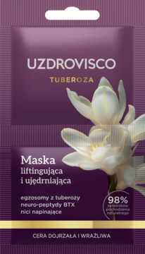 UZDROVISCO TUBEROZA Maska liftingująca i ujędrniająca. Fioletowa saszetka z białym kwiatem, widok z przodu.