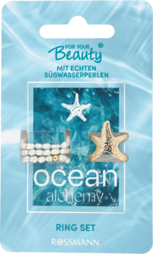 Zestaw pierścionków For Your Beauty Ocean Alchemy z perłami i złotą rozgwiazdą, w błękitnym opakowaniu Rossmann.