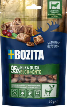 Bozita łoś & kaczka, 70g. Niebieska torebka z przysmakami dla psów, widok z przodu, pokazująca granulki i owoce.