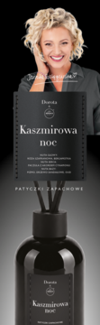 Dyfuzor zapachowy Dorota Kaszmirowa Noc, czarna butelka z patyczkami. Nad nim uśmiechnięta Dorota Gardias.