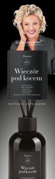 Czarny dyfuzor zapachowy Dorota "Wieczór pod kocem" z patyczkami, pod wizerunkiem uśmiechniętej blondynki.