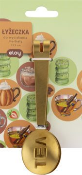 Złota łyżeczka Eloy do wyciskania herbaty, z wytłoczonym napisem TEA, na opakowaniu z motywami napojów.