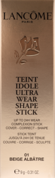 Beżowe opakowanie podkładu Lancôme Teint Idole Shape Stick 01 Beige Albâtre, widok z przodu, złote logo róży.