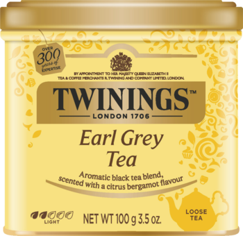 Złota puszka herbaty liściastej Twinings Earl Grey z bergamotką, widok z przodu. Jasnożółte tło, napisy w kolorze złota.