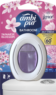 Ambi Pur Japanese Blossom odświeżacz łazienkowy, biały w kształcie toalety z fioletowym płynem w różowym blistrze.