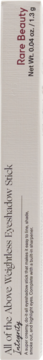 Białe opakowanie cienia Rare Beauty All of the Above Weightless Eyeshadow Stick Integrity, pionowy napis, 1.3g.