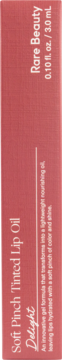 Pionowe ujęcie różowego pudełka Rare Beauty Soft Pinch Tinted Lip Oil Delight, z opisem formuły i pojemnością 3ml.