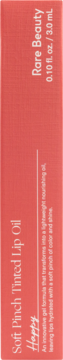 Side of Rare Beauty Soft Pinch Tinted Lip Oil box, shade Happy, peach color, 0.10 fl. oz. / 3.0 mL.