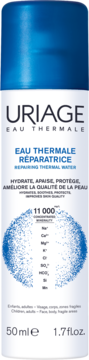 Biała butelka Uriage Eau Thermale Reparująca woda termalna 50ml, niebieska nakrętka, front z listą minerałów.