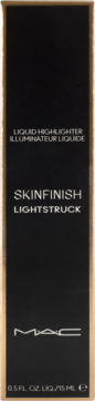Czarne opakowanie rozświetlacza w płynie MAC Skinfinish Lightstruck 15ml, ze złotymi krawędziami, widok z przodu.