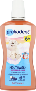 Płyn do płukania ust Prokudent Junior 6+ Wild Berry, brzoskwiniowa butelka z misiem polarnym na etykiecie.