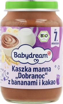 Słoik Babydream Kaszka manna Dobranoc z bananami i kakao, brązowa zawartość, fioletowa etykieta, zielona nakrętka.