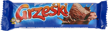 Niebieskie opakowanie Grześki, wafla z kremem kakaowym w czekoladzie, z przekrojem i logo.