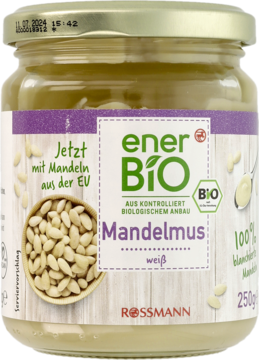 enerBiO Mandelmus Rossmann, biały mus z blanszowanych migdałów, w szklanym słoiku, widok z przodu.