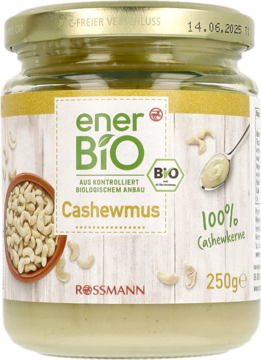 Słoik ekologicznego musu z orzechów nerkowca enerBiO Rossmann, 100% orzechów, kremowy kolor, widok z przodu.