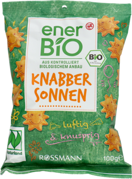 Zielone opakowanie enerBiO Krakersy słoneczka BIO 100g Rossmann, z wizerunkami wesołych słoneczek.