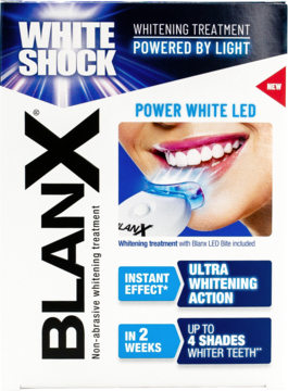 BlanX White Shock, białe pudełko z zestawem do wybielania zębów LED, widok z przodu. Grafika uśmiechu z lampą.