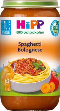 HiPP BIO Spaghetti Bolognese w słoiczku dla dzieci po 1. r.ż., z miską makaronu i słonikiem, widok z przodu.
