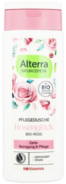 Alterra Rosenglück BIO-ROSE żel pod prysznic w białej butelce z różową zakrętką i grafiką róż, widok z przodu.