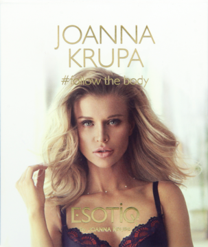 Plakat reklamowy perfum Esotiq Joanna Krupa: kobieta z blond włosami, dekolt, hasło #followthebody.