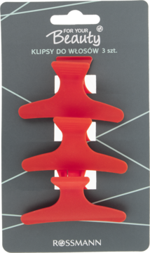 Zestaw trzech czerwonych klipsów do włosów For Your Beauty na szarym opakowaniu Rossmann, widok z przodu.