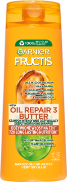 Pomarańczowa butelka szamponu Garnier Fructis Oil Repair 3 Butter, do włosów suchych, widok z przodu.