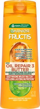 Pomarańczowa butelka szamponu Garnier Fructis Oil Repair 3 Butter, do włosów suchych, widok z przodu.