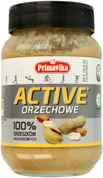 Primavika Active Orzechowe, masło arachidowe 100% w szklanym słoiku z żółtą etykietą, widok z przodu.