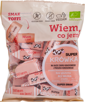Front różowej torebki Super Krówka Toffi, wegańskie bezmleczne cukierki, z widocznymi owiniętymi krówkami.
