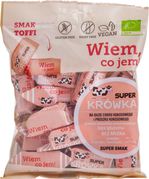 Front różowej torebki Super Krówka Toffi, wegańskie bezmleczne cukierki, z widocznymi owiniętymi krówkami.