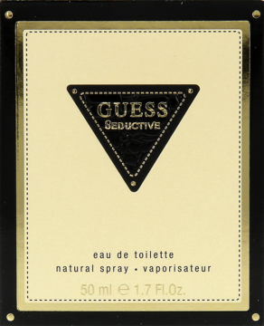 Pudełko Guess Seductive eau de toilette 50 ml, beżowe z czarnym trójkątem i złotymi detalami, widok frontalny.