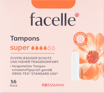 Różowe pudełko tamponów Facelle Super 56 sztuk z kwiatowym wzorem, obok jeden biały tampon na tle Rossmann.