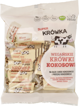 Przezroczysta torba Super Krówka Wegańskie Krówki Kokosowe, indywidualnie pakowane beżowe cukierki z krową.