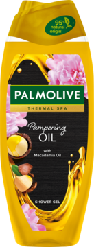 Żółty żel Palmolive Thermal Spa Pampering Oil z makadamią. Etykieta z różowymi kwiatami i orzechami.