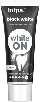 Tołpa black white wybielająca pasta do zębów z węglem, czarna tubka z białymi napisami, widok z przodu.