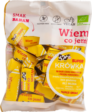 Przezroczysta torebka wegańskich krówek bananowych Super Krówka, widok z przodu, z indywidualnymi cukierkami.