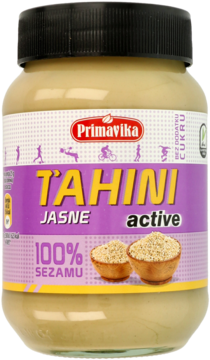 Słoik Primavika Tahini Jasne Active 100% sezamu, z fioletowo-żółtą etykietą i czarną zakrętką, widok z przodu.