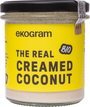 Słoik Ekogram The Real Creamed Coconut BIO, organiczna pasta kokosowa do jedzenia i ciała, żółta etykieta.