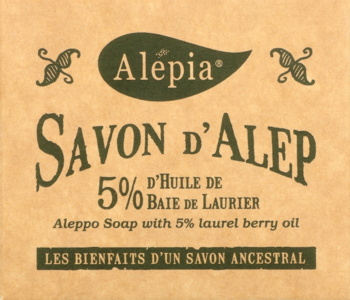 Front of Alépia Aleppo Soap package, light brown, with elegant dark green text detailing 5% laurel berry oil.