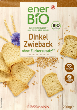 EnerBio Dinkel Zwieback BIO, bez dodatku cukru. Beżowe opakowanie z widocznymi sucharkami, ziarnami i kwiatem zboża.