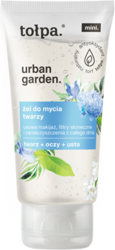 Tołpa Urban Garden mini żel do mycia twarzy, biała tubka z zielonymi liśćmi i niebieskimi kwiatami, usuwa makijaż.