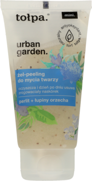 Tołpa Urban Garden żel-peeling mini w białej, półprzezroczystej tubce z widocznymi drobinkami, przód.