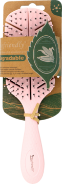 Różowa biodegradowalna szczotka do włosów na brązowym opakowaniu z zielonym liściem i napisem 'eco friendly', widok z przodu.
