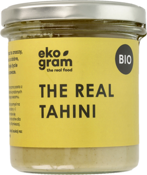 Słoik Eko gram The Real Tahini, organiczna pasta sezamowa BIO z Grecji, z żółtą etykietą, widok z przodu.